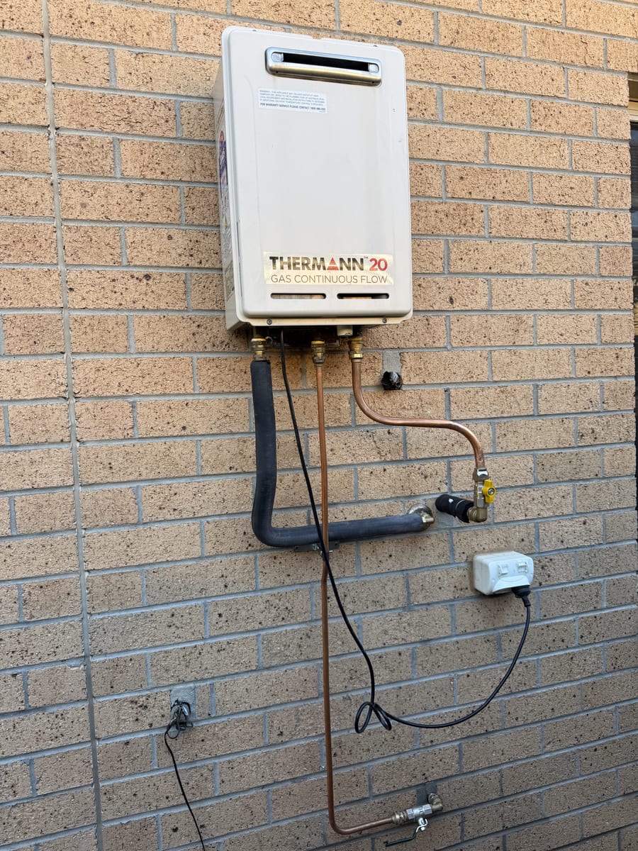 Gas continuous flow hot water unit connected with new gas and water lines